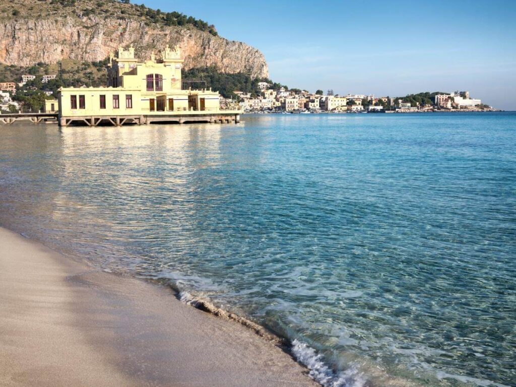 Pastel seaside villas and turquoise water at Mondello Beach near Palermo, Sicily