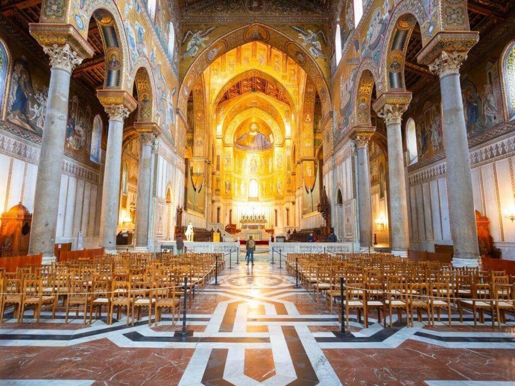 Interior view of Monreale Cathedral near Palermo, covered in golden Byzantine mosaics