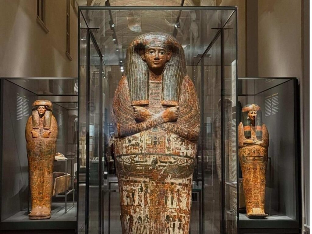Ancient Egyptian statues and sarcophagi inside Museo Egizio, Turin.