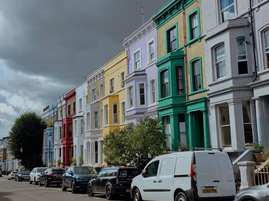 Romantic evening walk down a quiet, pastel-colored street in Notting Hill, London.