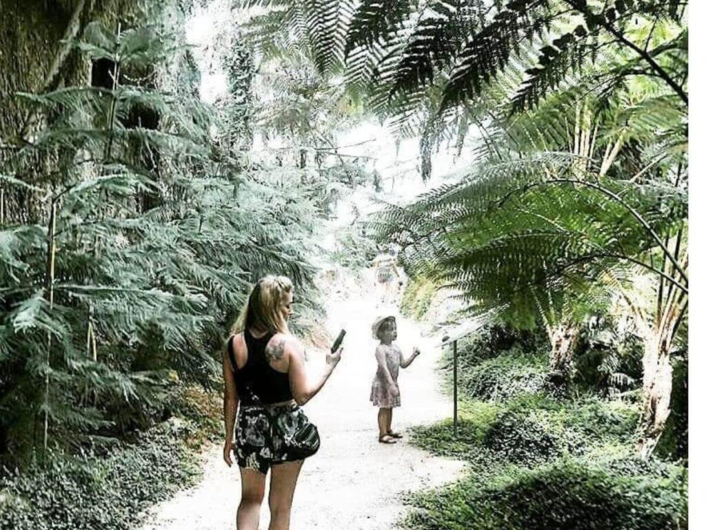 Visitors walking through the tropical rainforest exhibit at Oltremare Riccione