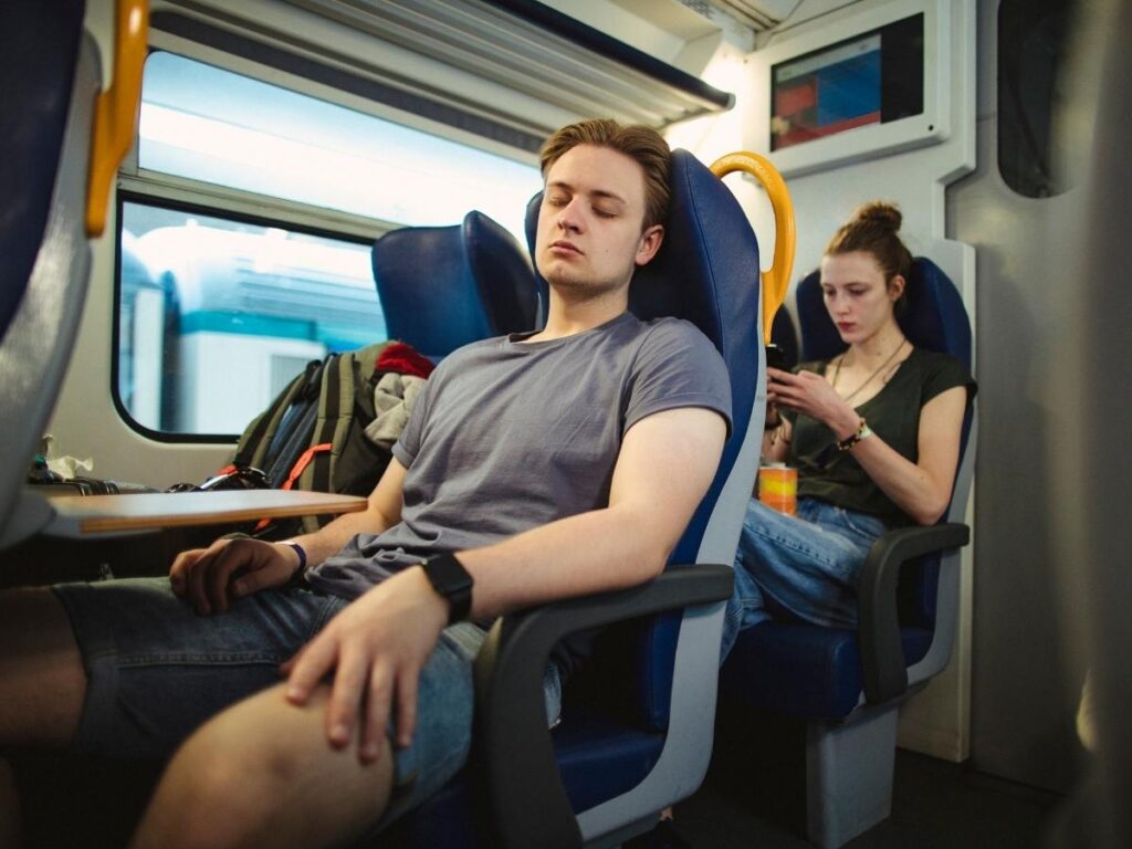 Taking overnight trains or flights to save on hotel costs