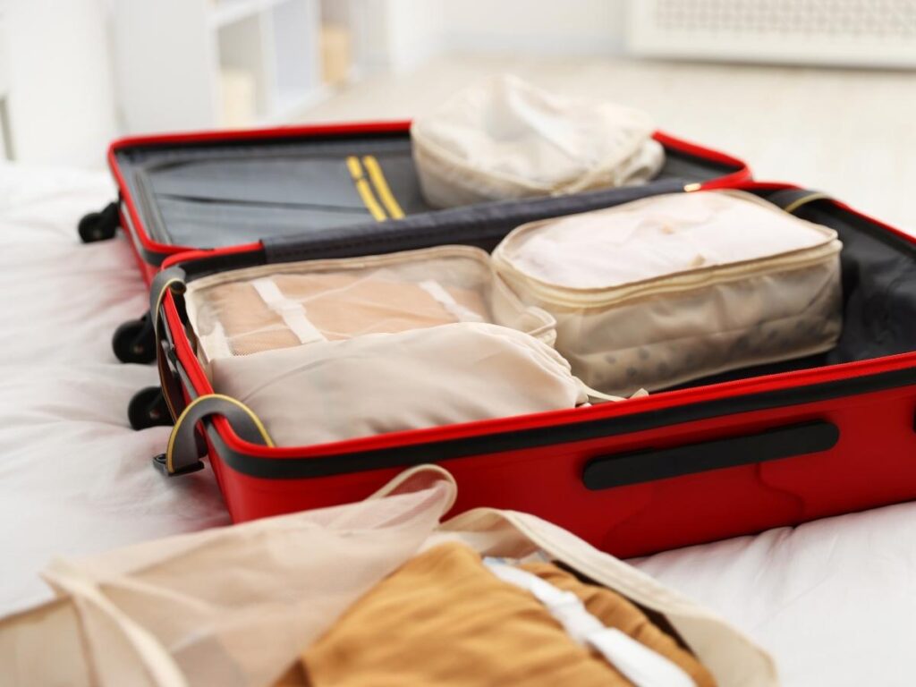 How to pack light for budget travel using packing cubes and carry-on