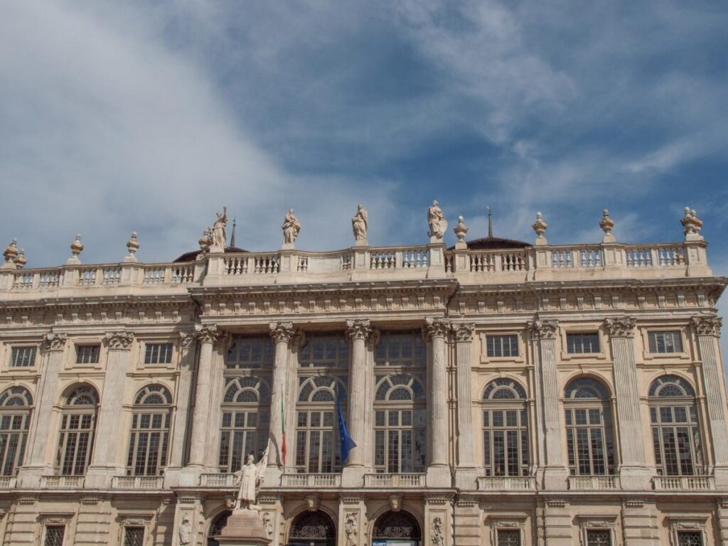 View over Turin from the rooftop terrace of Palazzo Madama at golden hour.