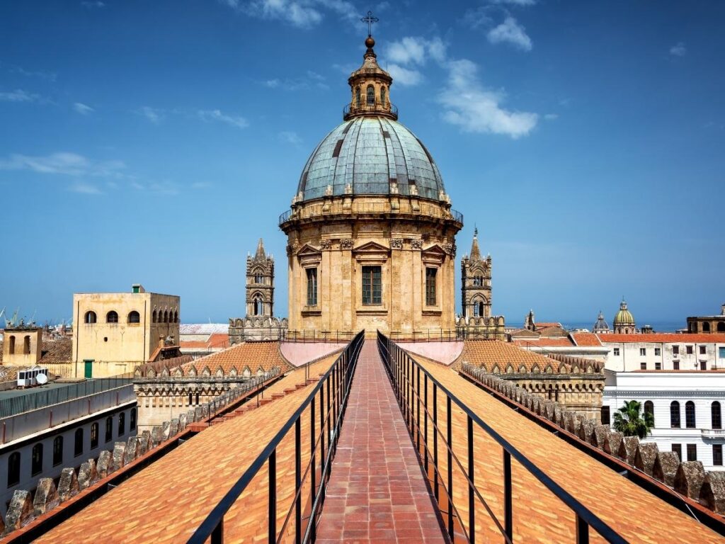 Panoramic view of Palermo’s rooftops and domes from the cathedral terrace at sunset