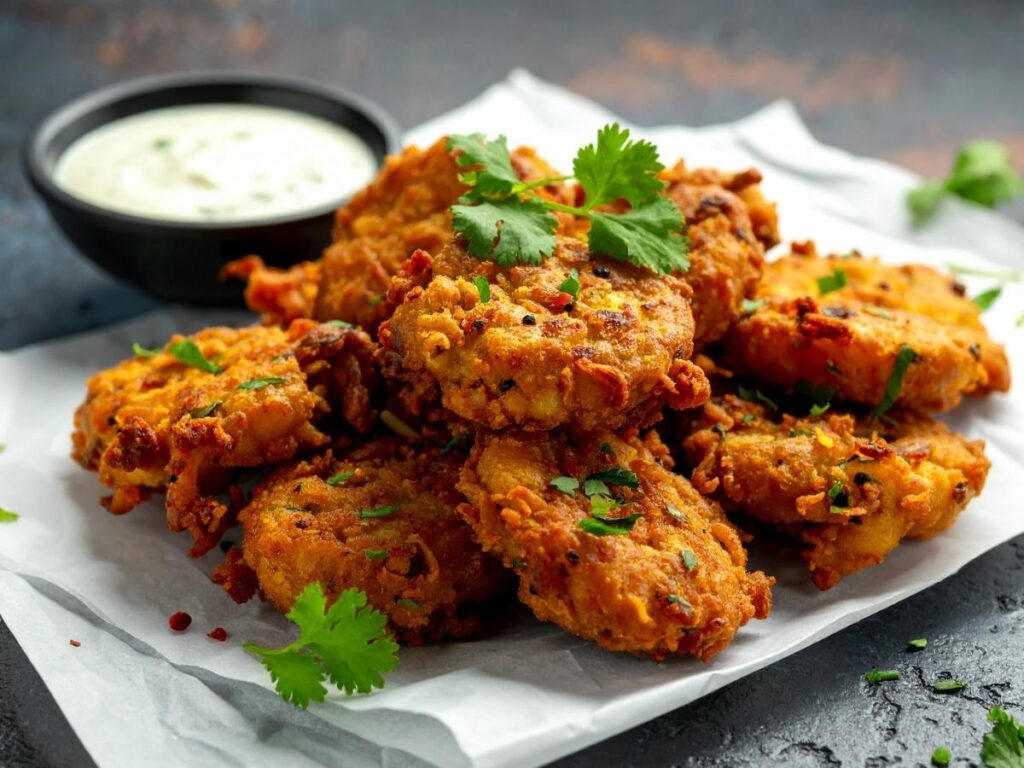 Crispy Sicilian panelle fritters stacked at a street-food stall in Palermo’s Ballarò Market