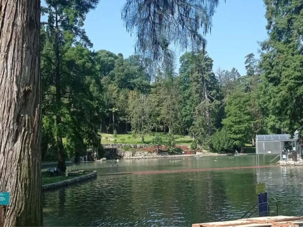 Thermal pools at Parco Termale di Colà with guests relaxing surrounded by greenery