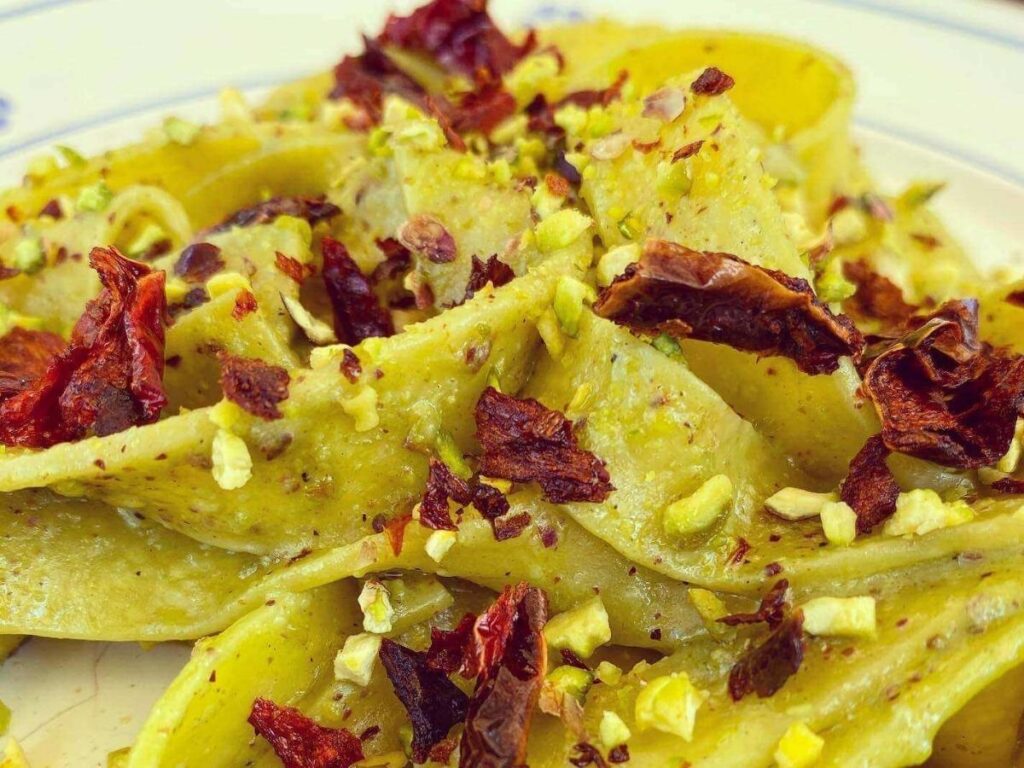 Fried peperoni cruschi piled on a rustic plate, ready to serve.
