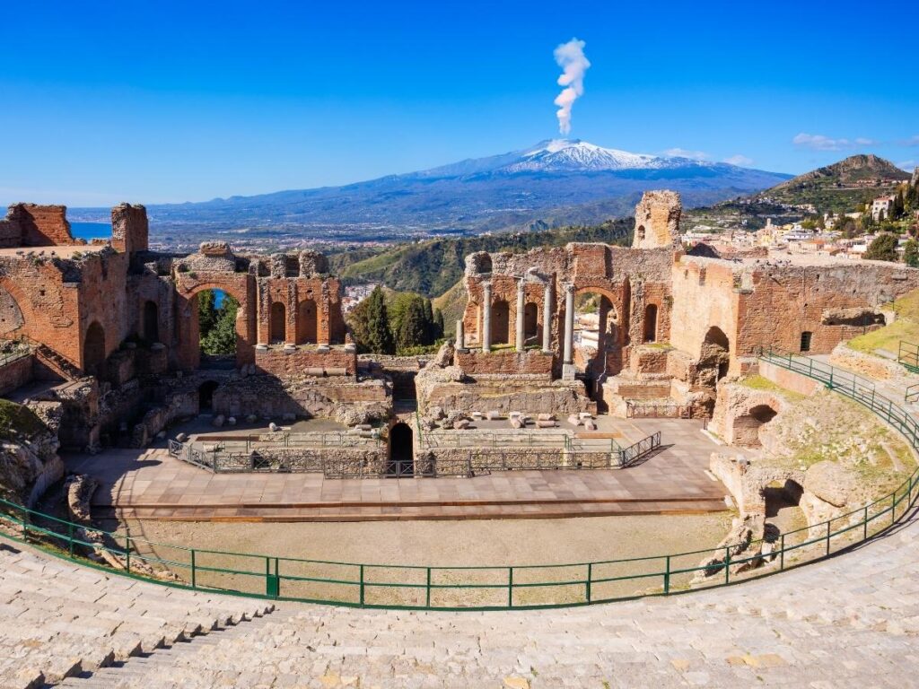 Stone seats of the Samnite theater at Pietrabbondante with mountain ridges in the background.
