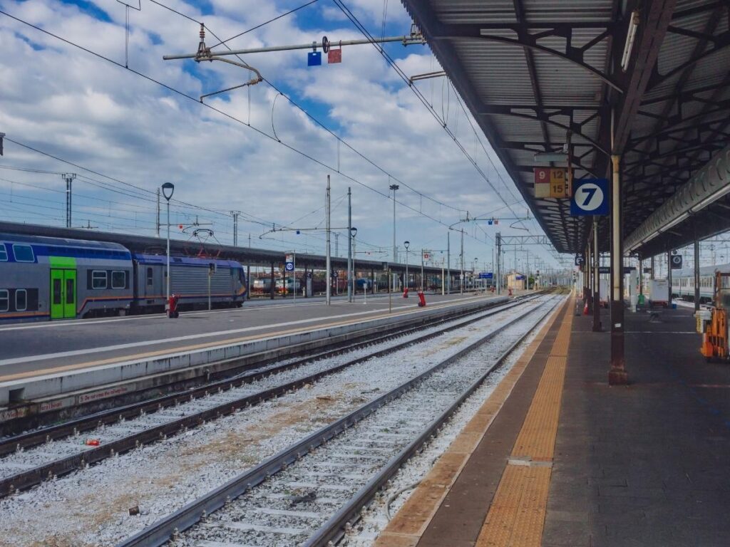 Verona Porta Nuova train station exterior with travelers and taxis.”