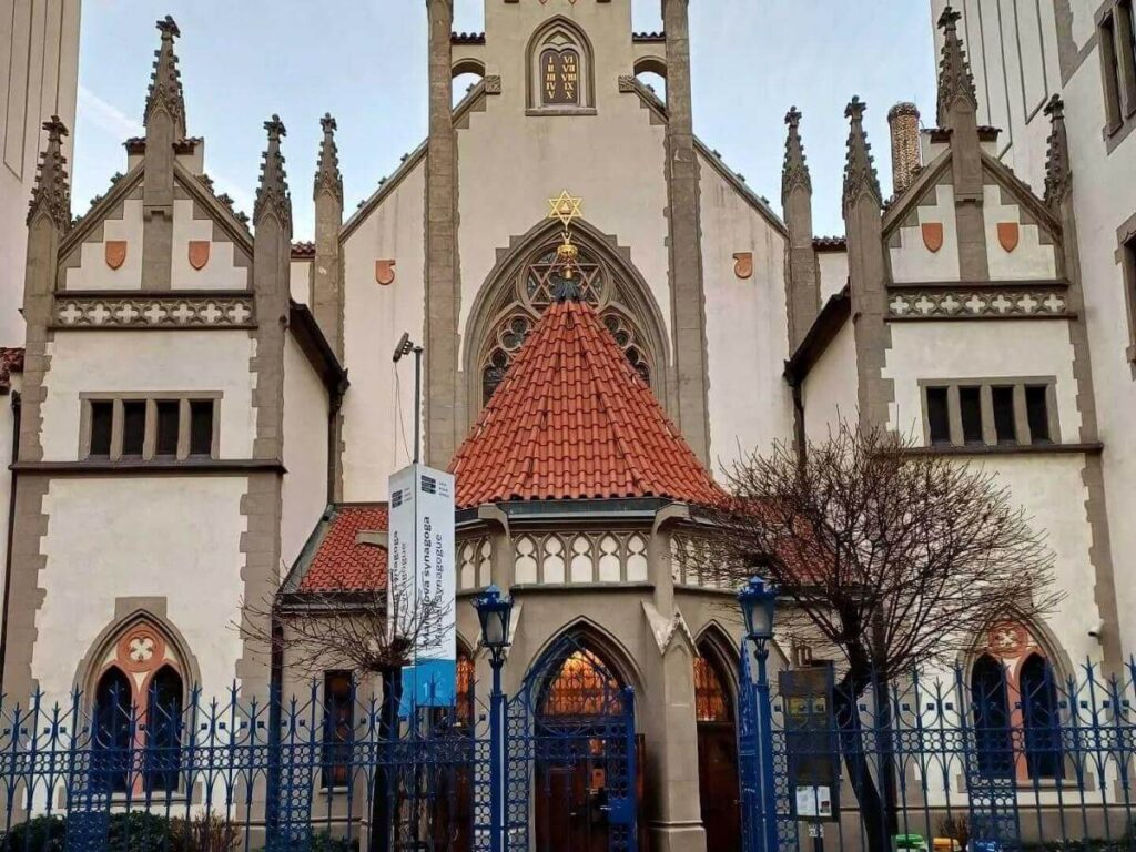 Quiet lane in Josefov, the Jewish Quarter, showing historic synagogues and stone pathways in Prague.