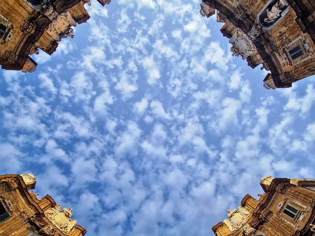 Locals eating and drinking at open-air bars in Vucciria Market at night, Palermo