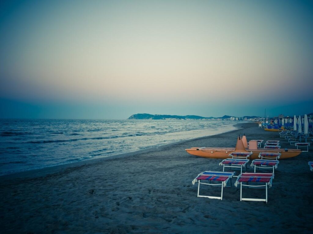 Locals enjoying a morning swim on a free public beach in Riccione