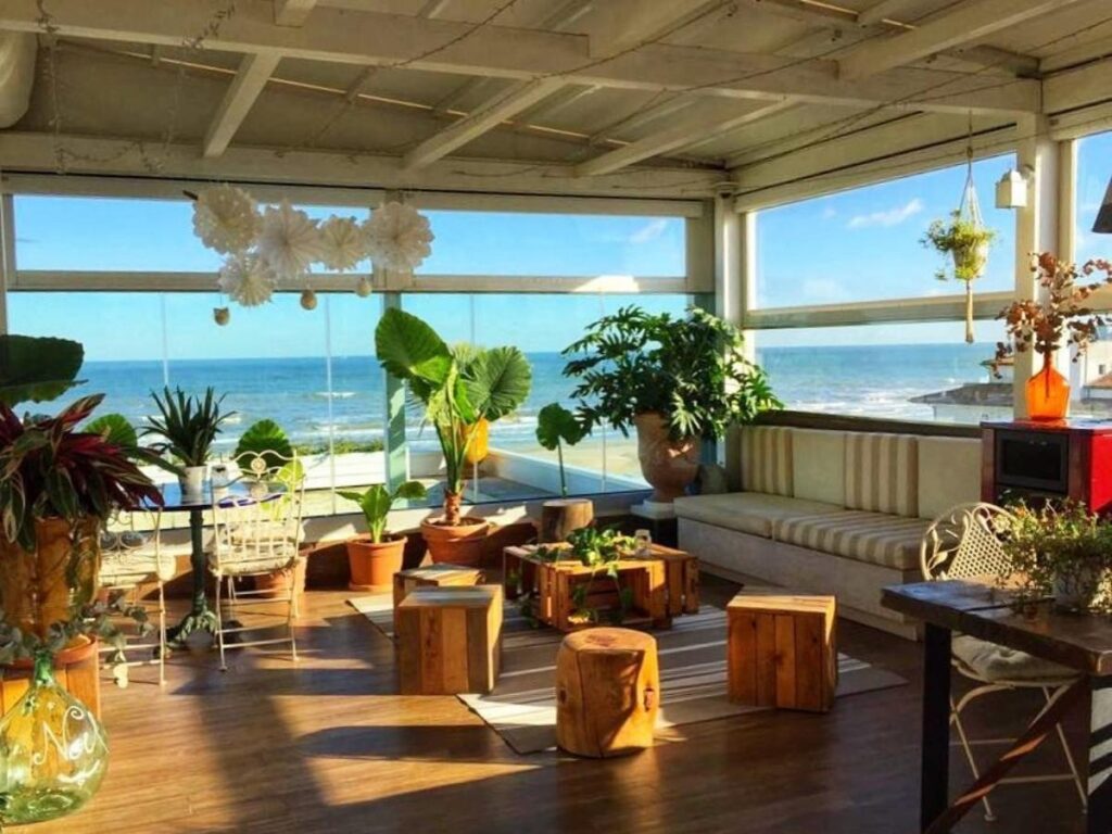 View of the Adriatic Sea from a hotel balcony in Riccione with coffee cups on the table at sunrise