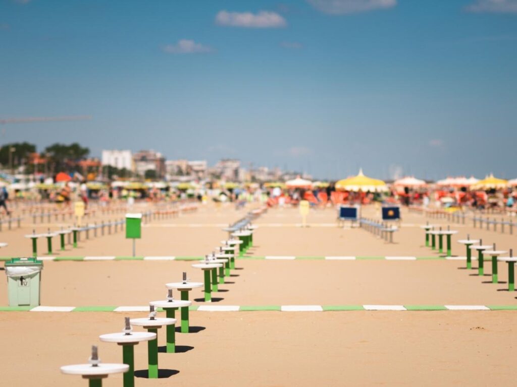 Busy Marina Centro beach with rows of lidos and umbrellas, Rimini.