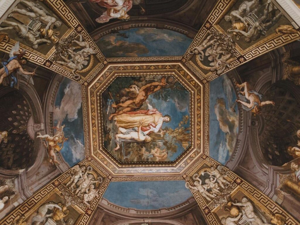 Close-up of faded frescoes inside a rupestrian (rock-cut) church in Matera.