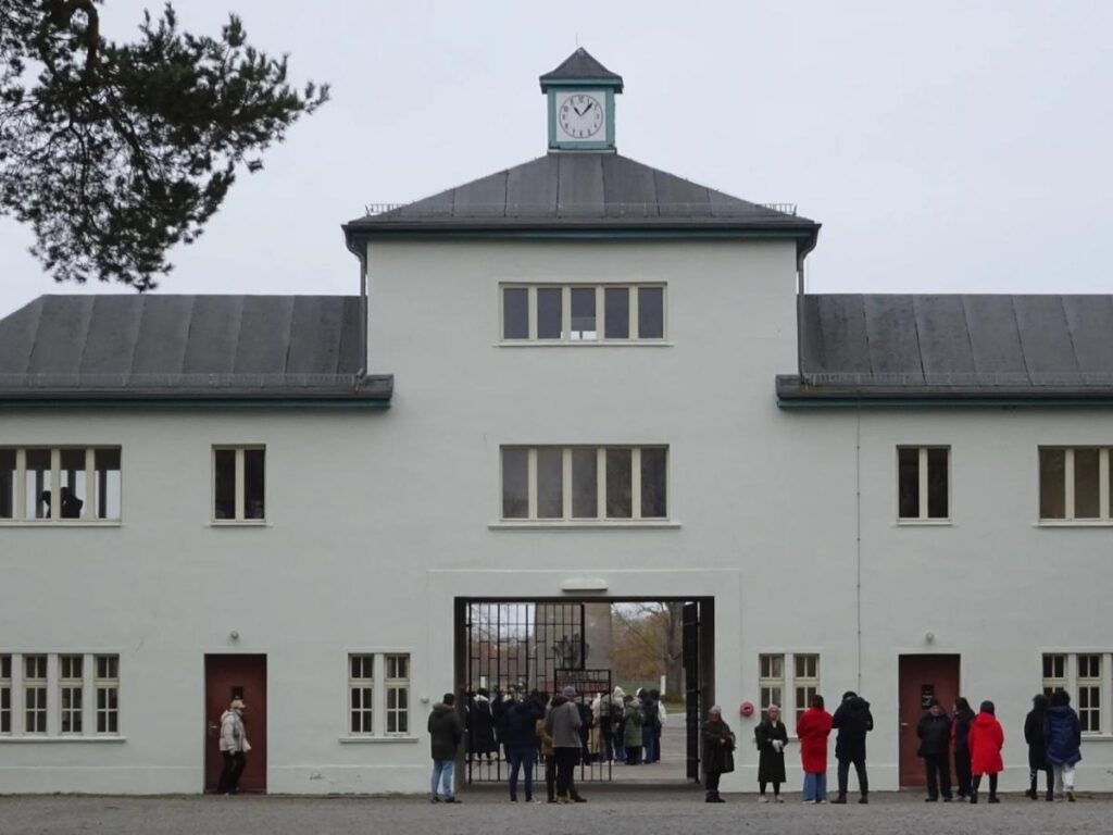 Path leading through Sachsenhausen Concentration Camp Memorial under a cloudy sky.