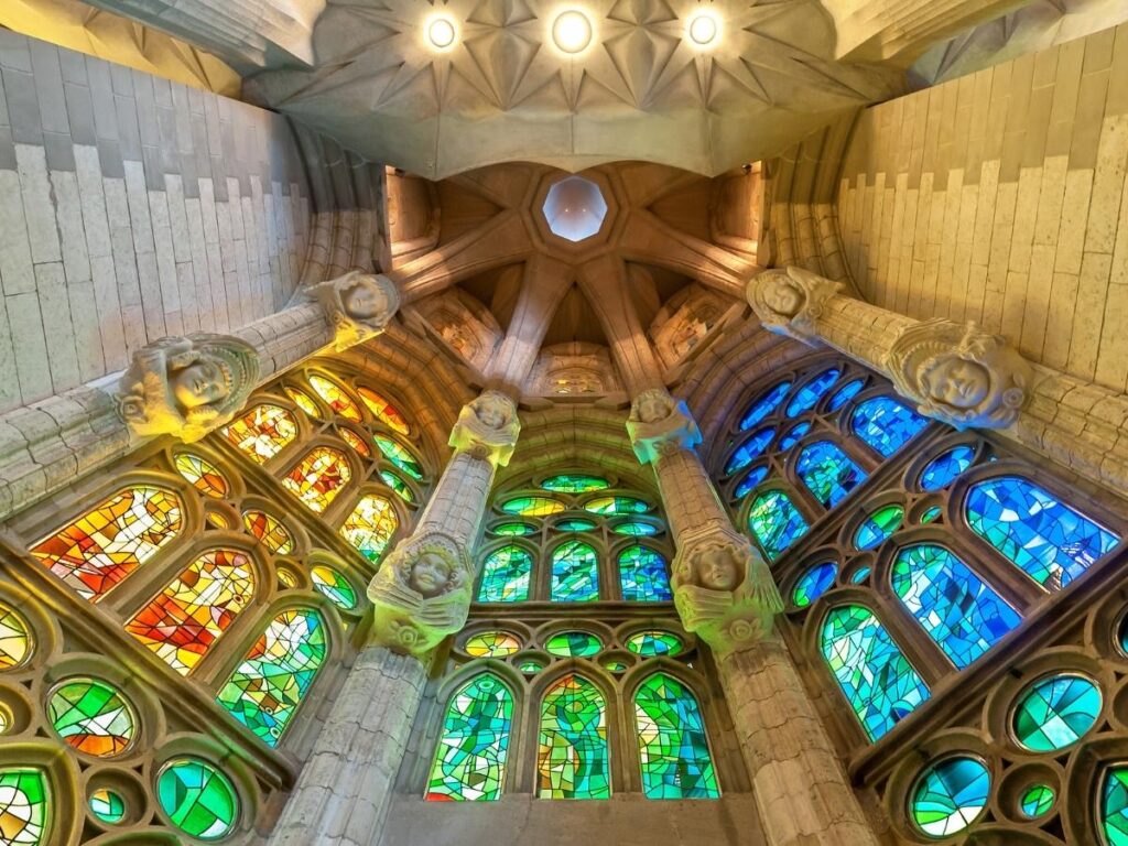 Morning light through stained glass inside Sagrada Família