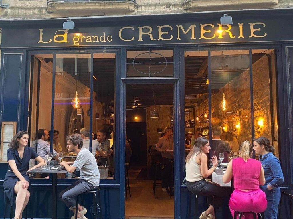 Traveler relaxing at a café table in Saint-Germain-des-Prés, Paris, with sunlight and coffee