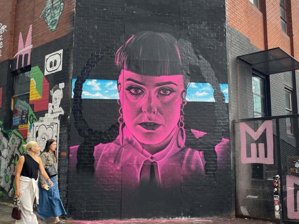 Colorful street art mural on a brick wall in Shoreditch, East London