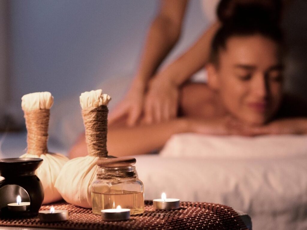 A luxury resort spa with a woman enjoying a massage