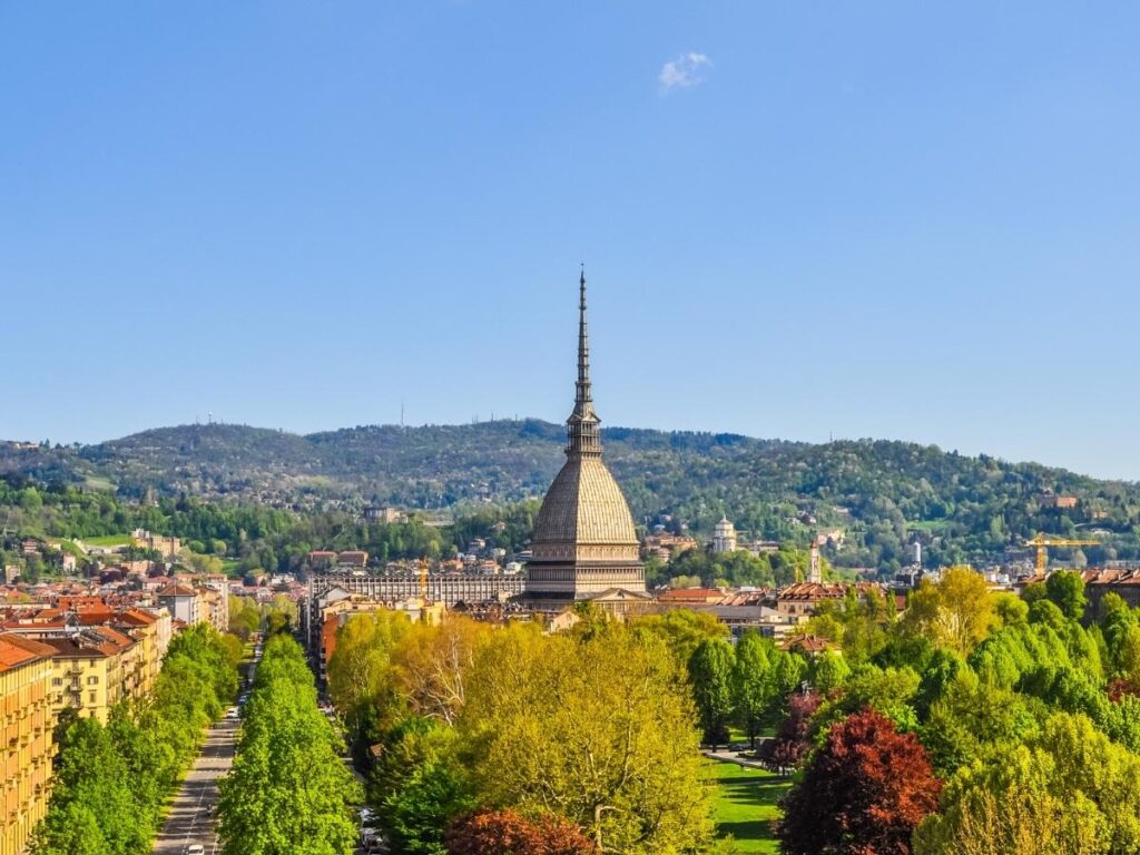 Mole Antonelliana rising above Turin’s skyline with the Alps on the horizon.