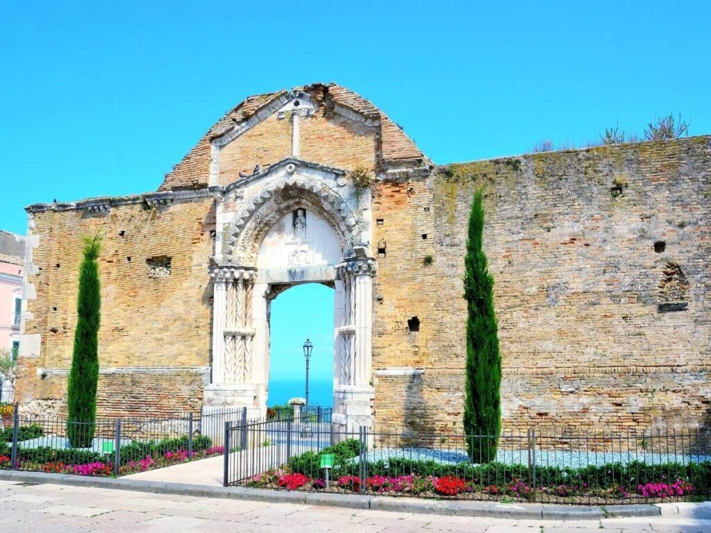 Cliff-top view of Vasto’s old town overlooking sandy beaches and the Adriatic coast at midday