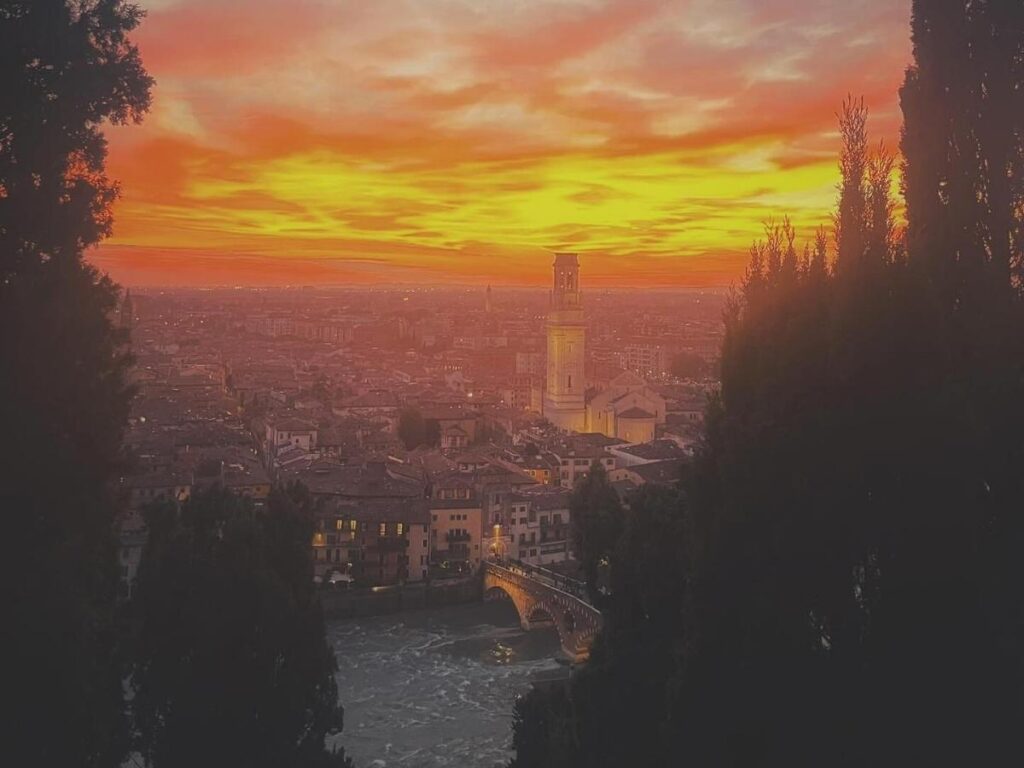“Quiet residential street in Veronetta district, Verona, across the Adige River.”