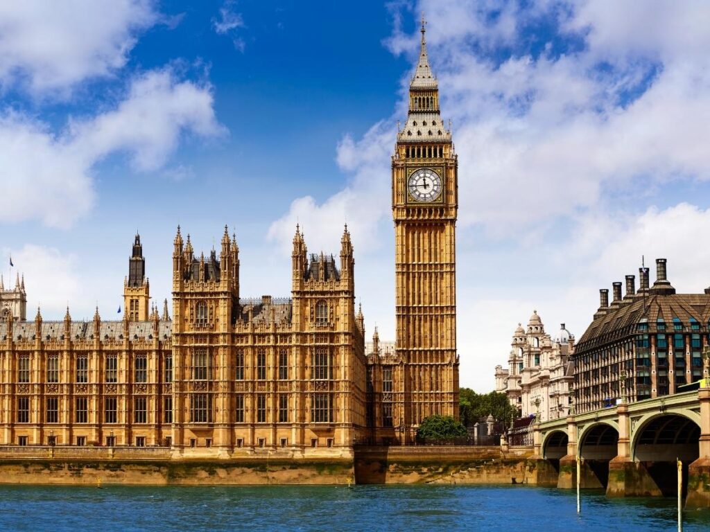 “Morning light on Westminster Abbey and Big Ben in central London, with quiet streets before the crowds.”
