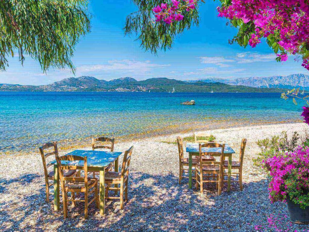 Agali beach shoreline with sunbeds and a seafront taverna in the background, Folegandros