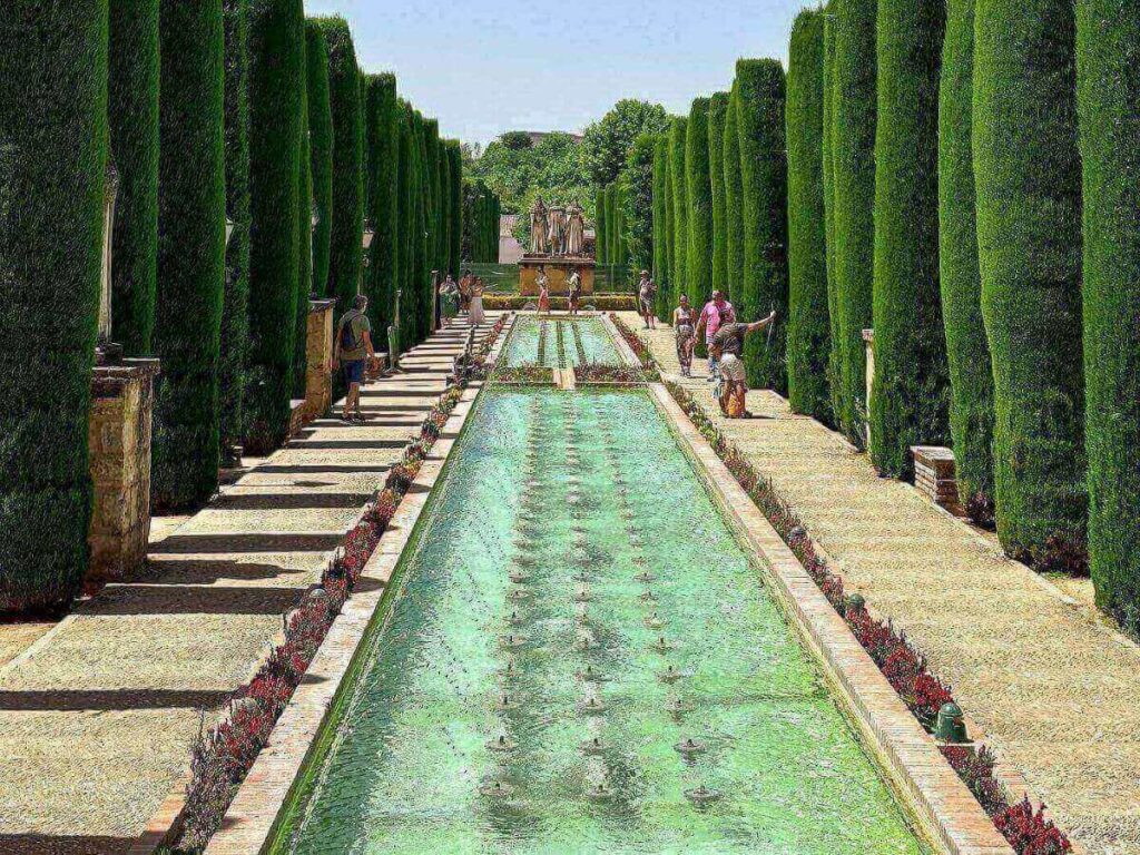 Alcázar de los Reyes Cristianos gardens with long reflecting pools and orange trees
