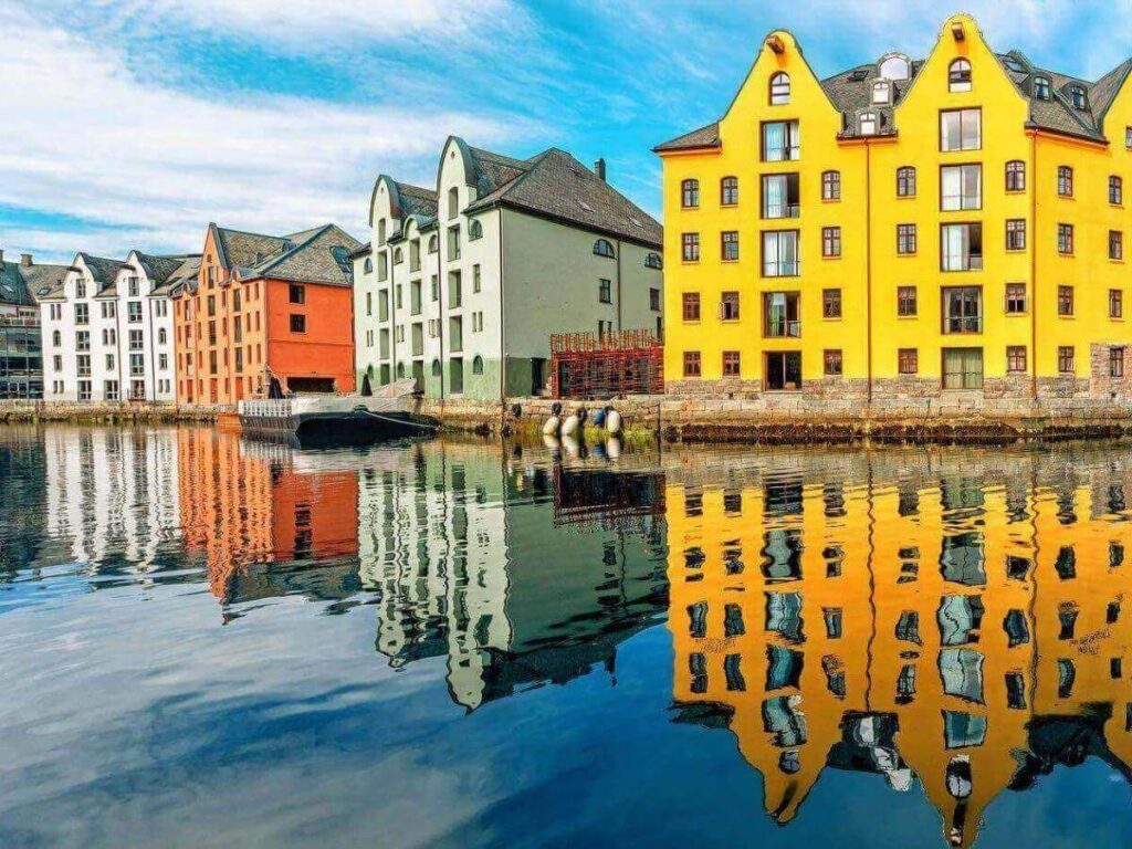Close-up of an ornate Art Nouveau doorway and stone carvings in Ålesund