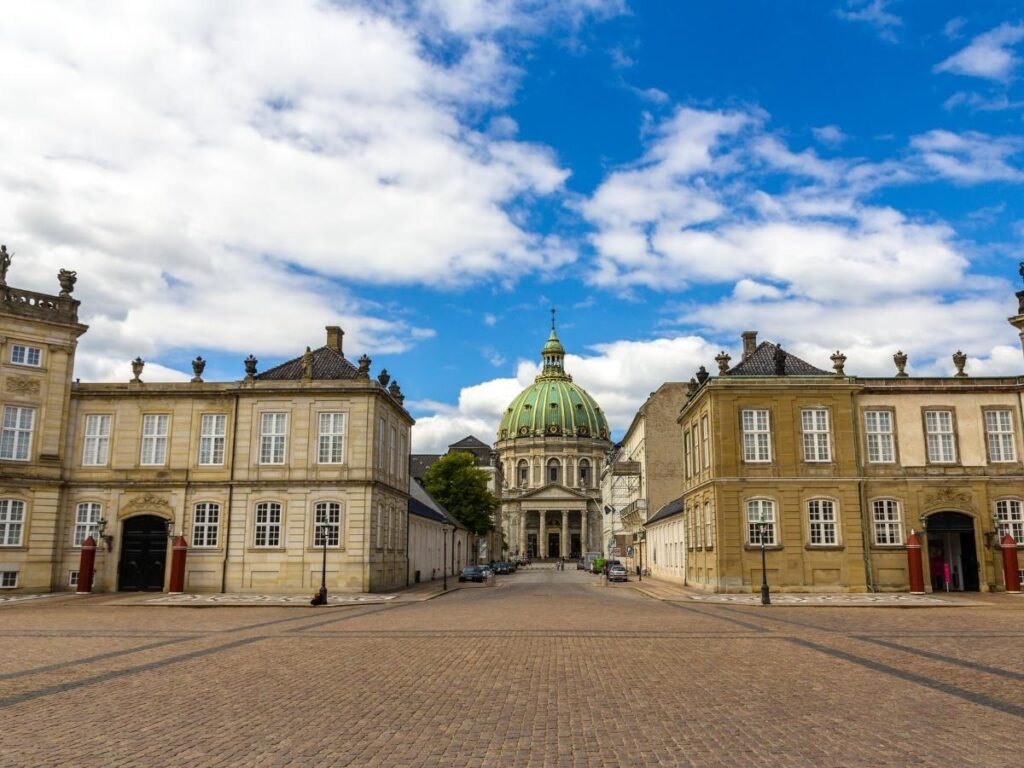 Amalienborg Palace and the Marble Church under blue skies in Copenhagen’s city center.