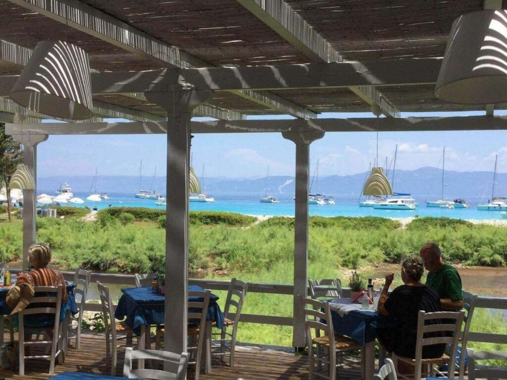 Beach taverna on Antipaxos serving grilled fish and salad with sea views