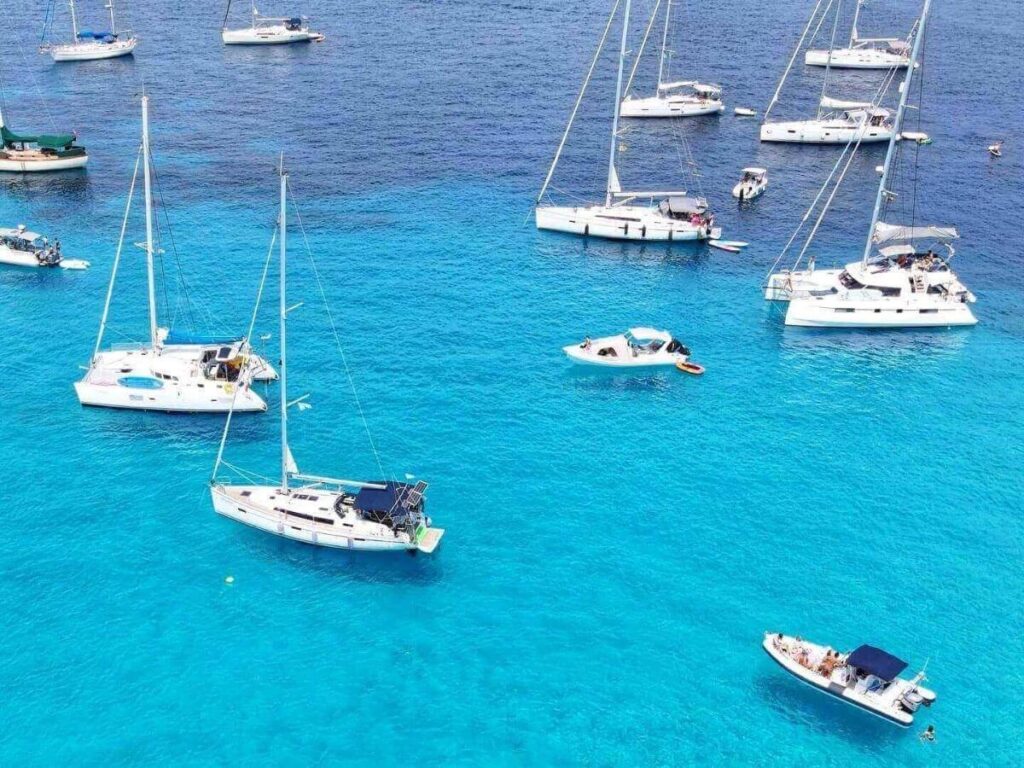 Small boat taxi moving between Voutoumi and Vrika beaches on Antipaxos island