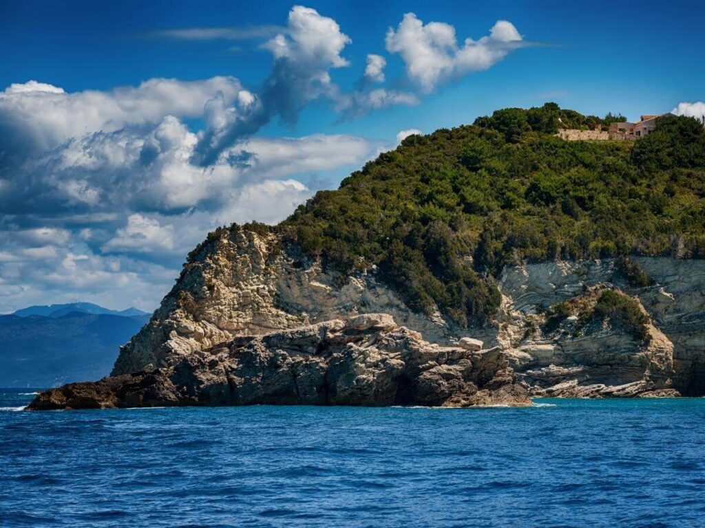 Snorkeller exploring clear waters and rock formations near Antipaxos