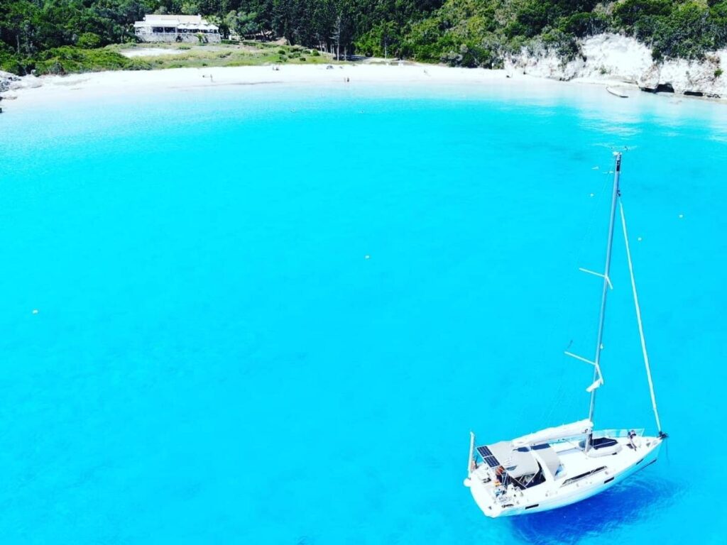 Gentle waves washing onto the white sand at Voutoumi Beach, Antipaxos