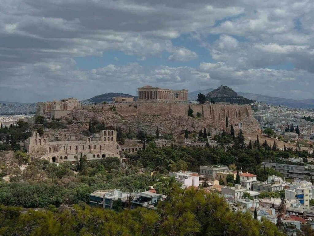 Panoramic view of the Acropolis from Areopagus Hill at golden hour with the city spread below