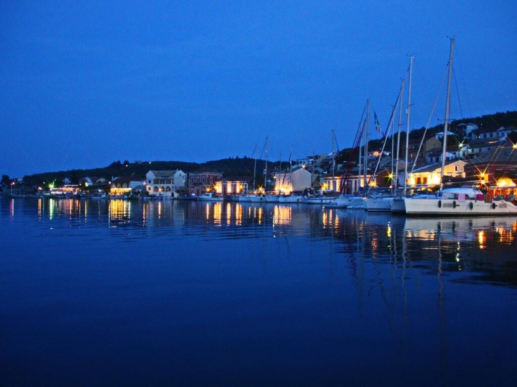 “Quiet morning view of Gaios harbour in Paxos with boats anchored along the waterfront