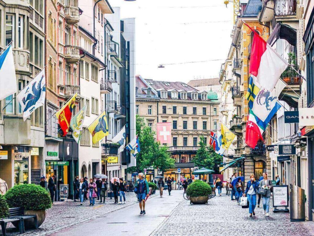 Boutique storefronts and trams along Bahnhofstrasse