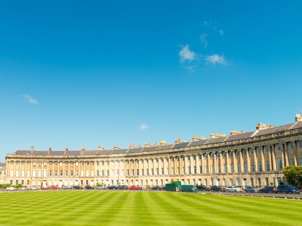 The sweeping curve of the Royal Crescent seen from the grassy lawn in front