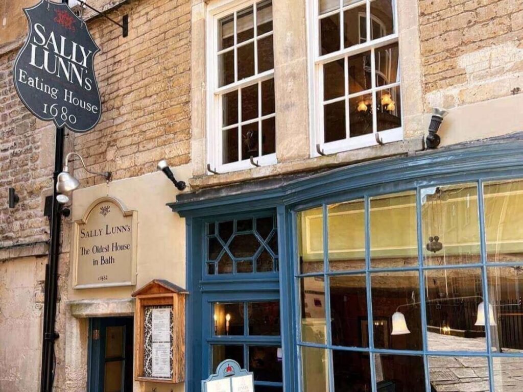 Exterior of Sally Lunn’s historic teahouse with its old stone front and hanging sign