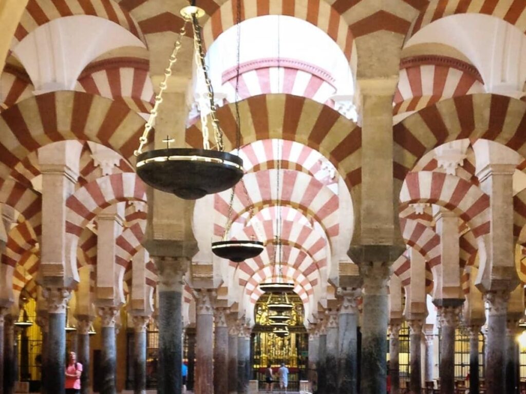 Red-and-white arches inside the Mezquita in Córdoba