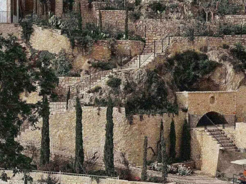 Narrow stone alley with traditional houses in Dhërmi Old Town