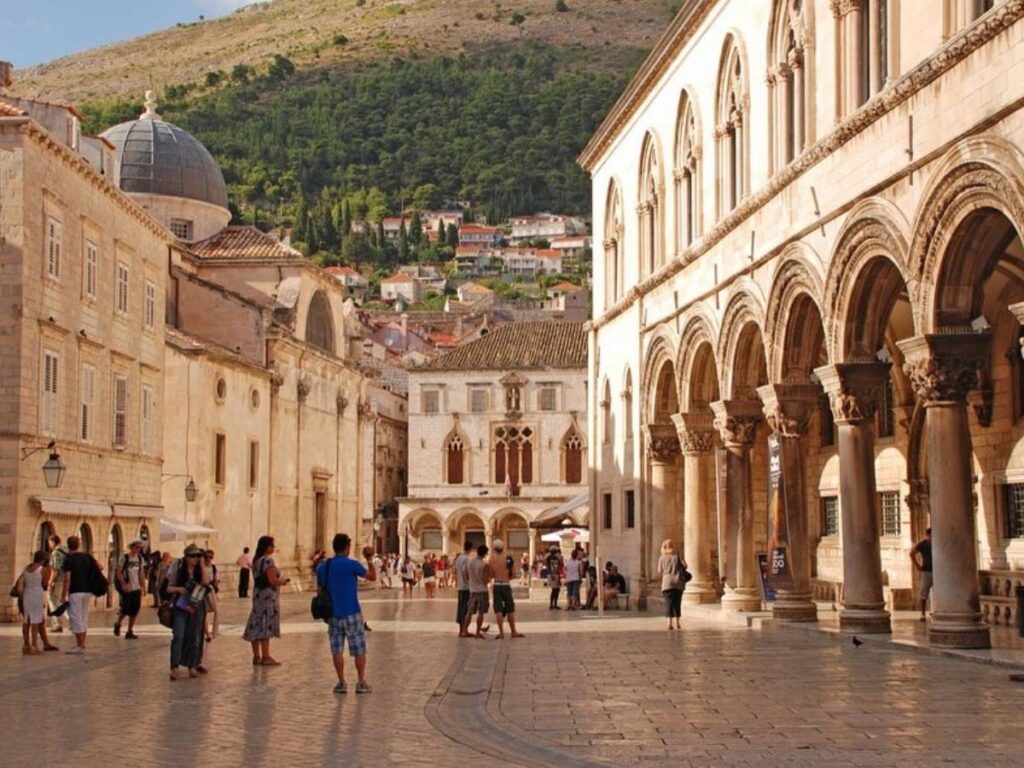Marble-paved Stradun promenade running through Dubrovnik Old Town with pedestrians