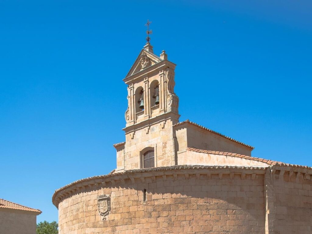 Sunny plaza and ochre-coloured tower of Èze’s Notre-Dame de l’Assomption church.