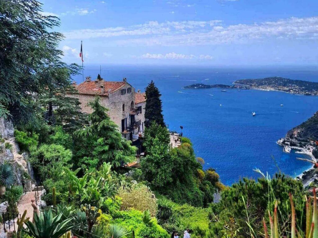 Clay sculpture set among succulents in the clifftop Jardin Exotique of Èze.