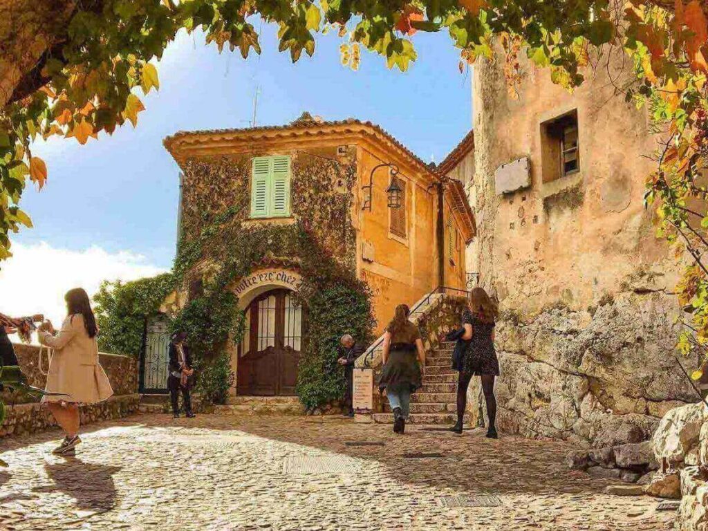 Ivy-covered stone doorway along a quiet backstreet in Èze Village