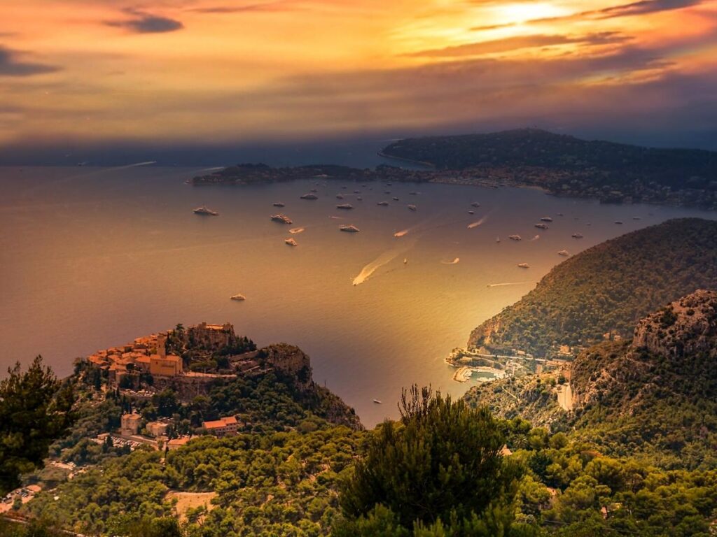 Warm sunset light falling over the rooftops and cliffs of Èze Village