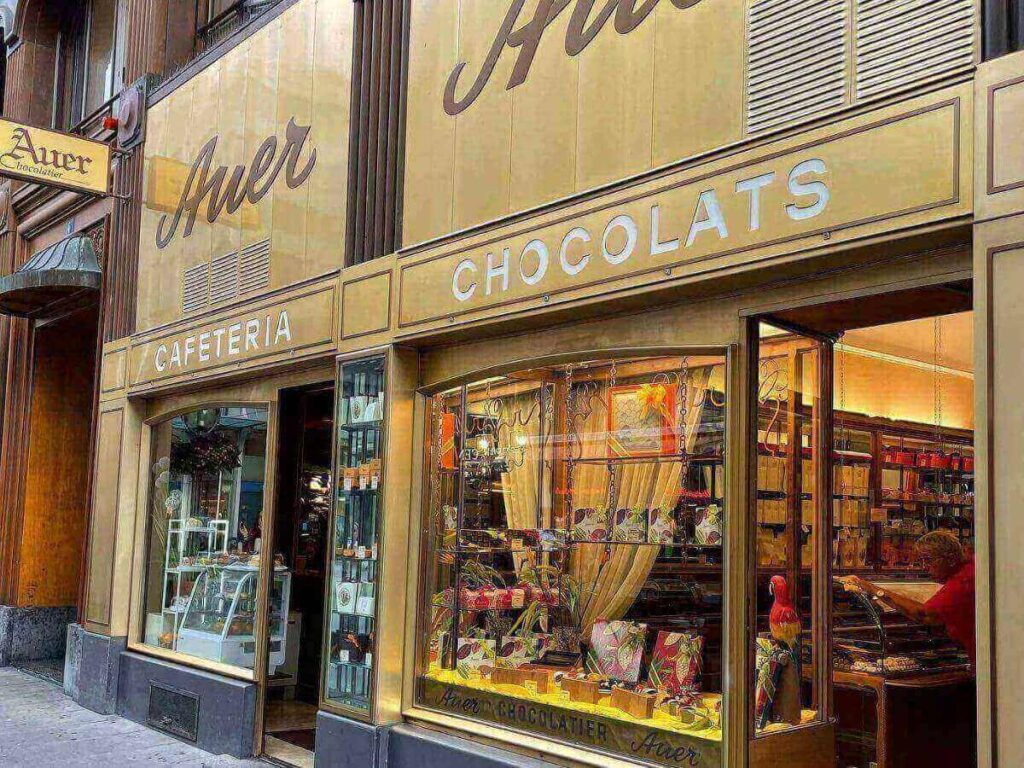 Selection of handmade pralines and truffles on display in a Geneva chocolate shop